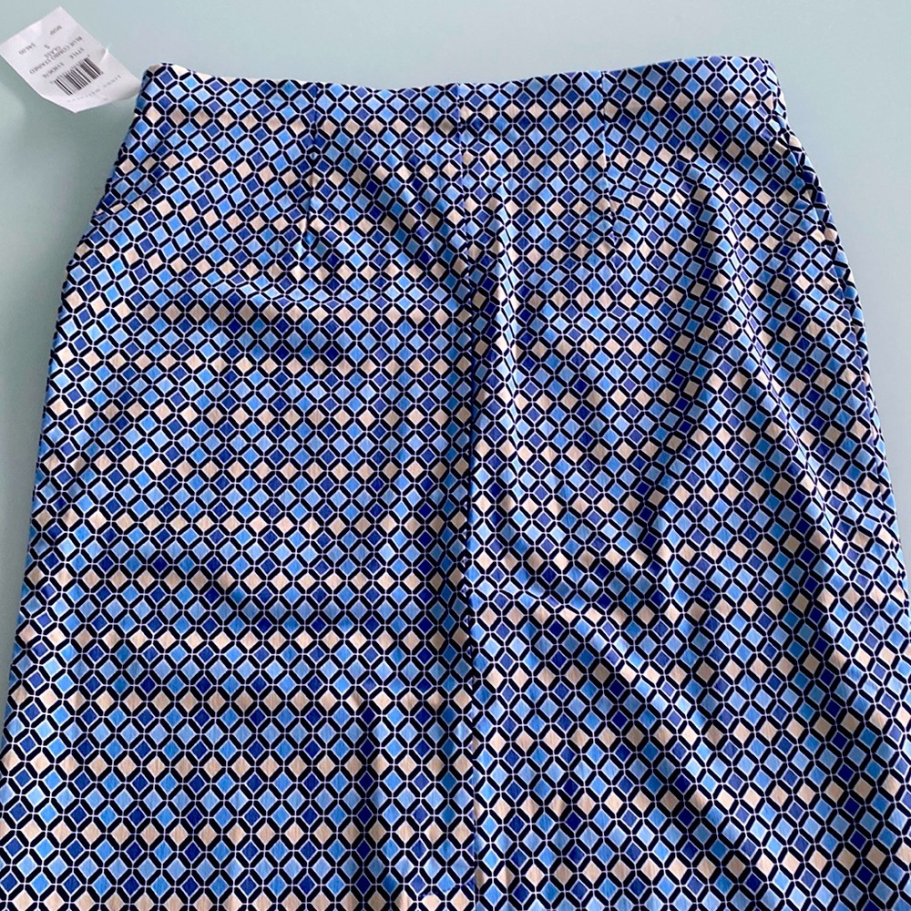 Linda Matthew brand- new mini shirt with back split.